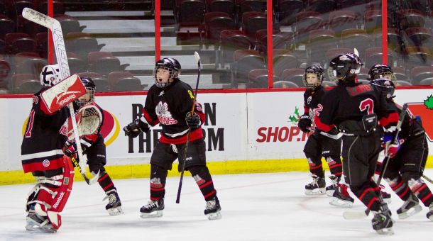 The Rams players celebrate their 1-0 win as the final horn sounds.