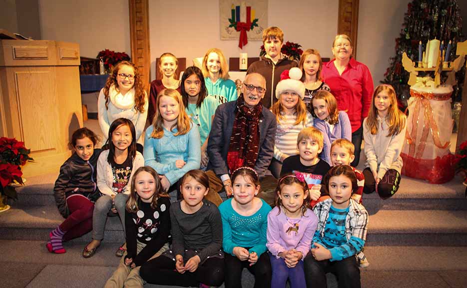 Musician Jerry Granelli (centre) with the Goulbourn Jubilee Singers, along with Artistic Director Linda Crawford in red in the back row. Photo by Barry Gray.