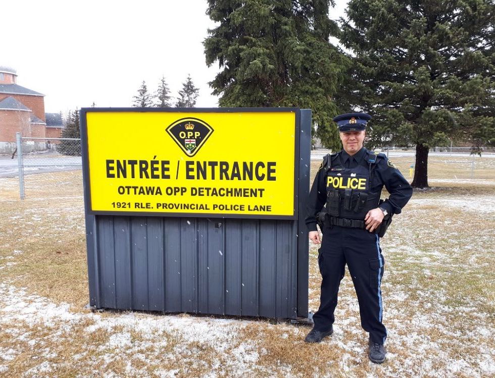 Photo: Mike Radke, retired OPP sergeant and Stittsville resident, in front of the OPP Kanata detachment. Photo via Stephanie Rudyk/SchoolBOX.