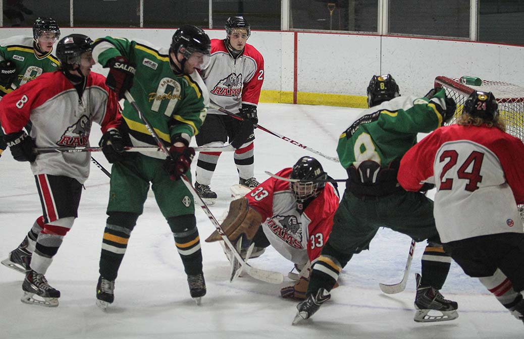 Rams goalie Matt Couvrette pounces on the puck in a goal mouth. Stittsville Rams went on to beat Arnprior Packers 4-3 in the second overtime period.