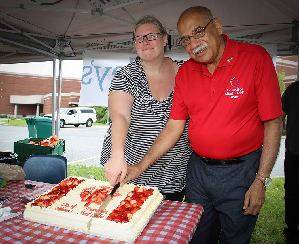 Stittsville Village Association president Tanya Hein and Councilor Shad Qadri cut the cake. Canada 2017 in Stittsville. Photo by Barry Gray.