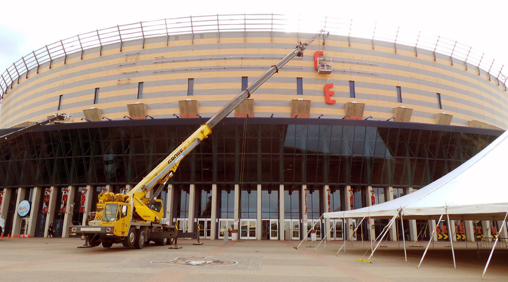 Installing the new Canadian Tire Centre sign in August 2013.