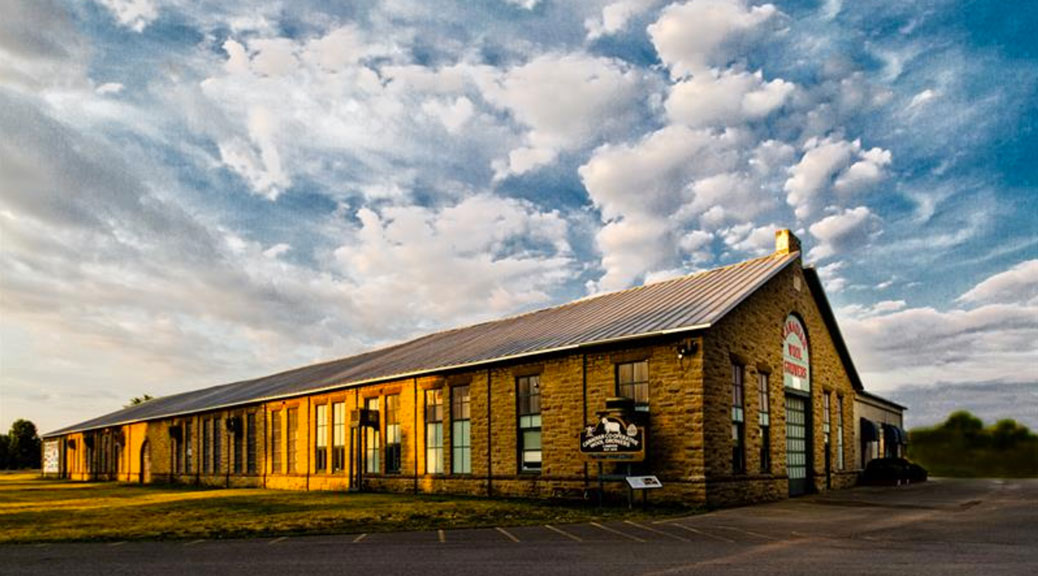 Canadian Co-operative Wool Growers Limited in Carleton Place. Constructed in 1890 of local limestone, this building contained the roundhouse and engine repair shops for the Canadian Pacific Railway (CPR) until 1939. In 1940, the building was purchased by the Canadian Co-operative Wool Growers. Wool arrives here from across the country and is graded before being shipped out in compact bales.