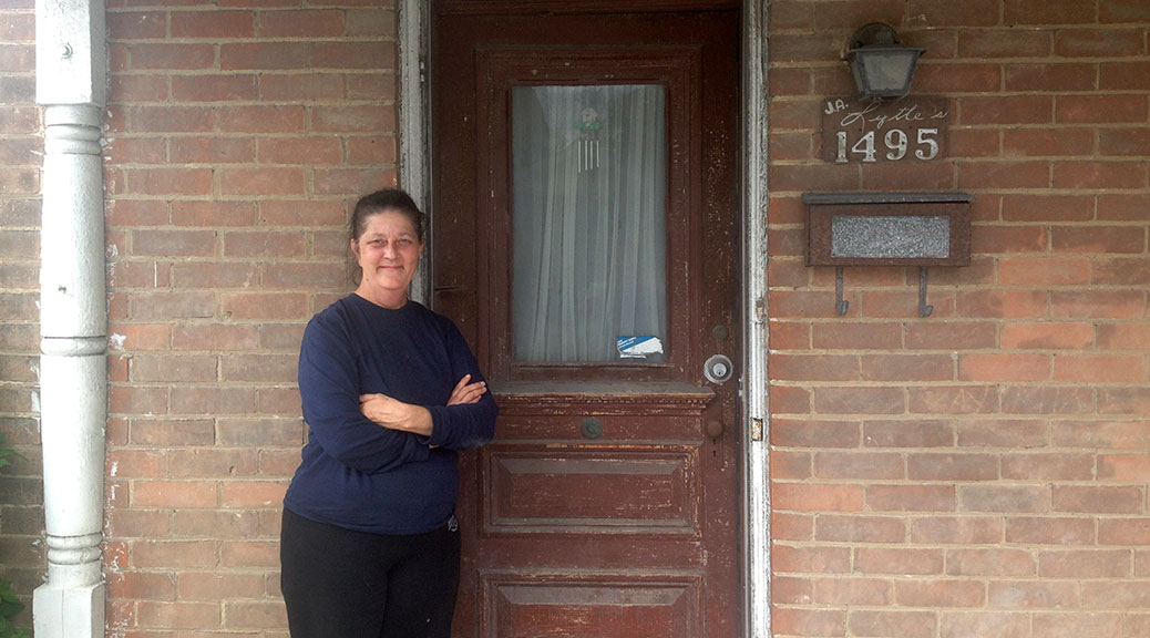 Cathy Lytle stands in front of her family's home at 1495 Stittsville Main Street.