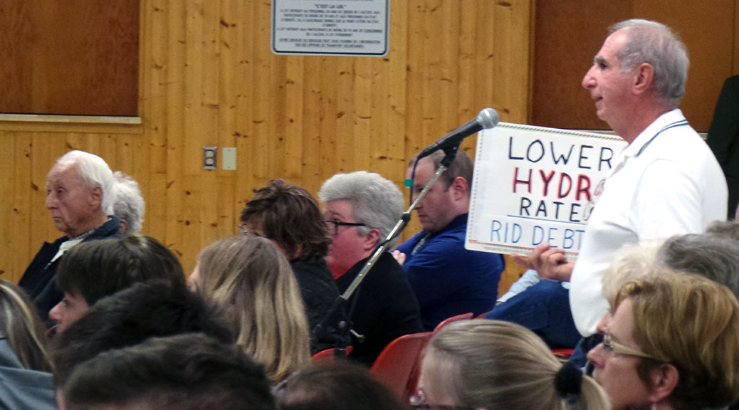 Stittsville debate. Guy with "Lower Hydro Rates" sign.