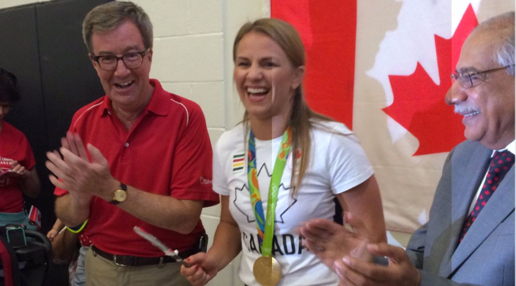 Erica Wiebe cuts the cake. Photo by Murilo Torres.