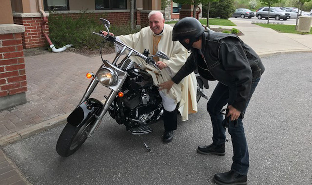 Monsignor Joseph Muldoon, Pastor at Holy Spirit Parish, rides a Harley.