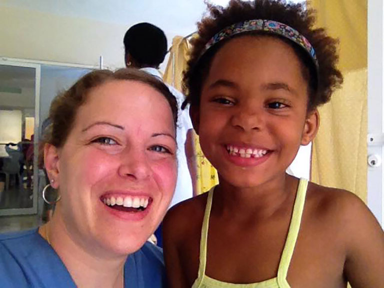 Shannon Helleman with one of the patients her team helped in the Dominican Republic.