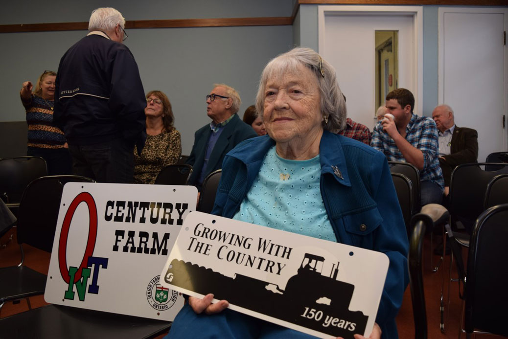 “We keep things going one way or another,” said Lillian Hobbs, 91, the owner of the Hobbs farm. When she was called up to receive her sign, she cracked: “I’m the oldest!” and sent the audience into a chuckle. Photo by Devyn Barrie.