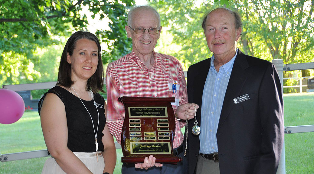 John Curry has been instrumental in the Goulbourn Museum's success and Kathryn Jamieson, Curator Manager, and the Museum's Chairperson, Keith Hobbs, presented him with the award at last night's Evening of Appreciation. (Photo via the Goulbourn Museum)
