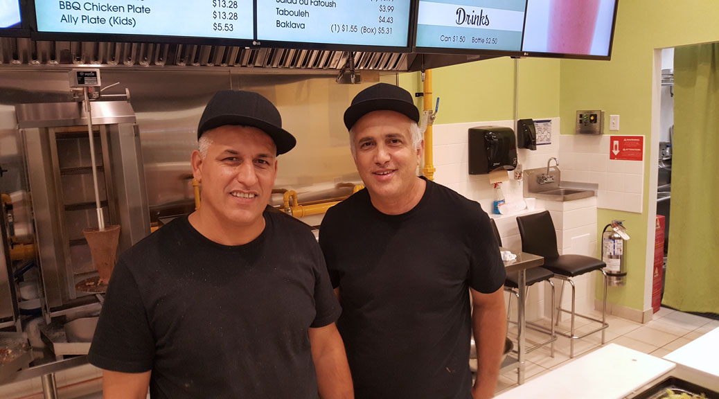 Just Shawarma owner Nedal Atieh (right) says that Bahaa Shakir (left) is the greatest shawarma chef in the city. Photo by Glen Gower