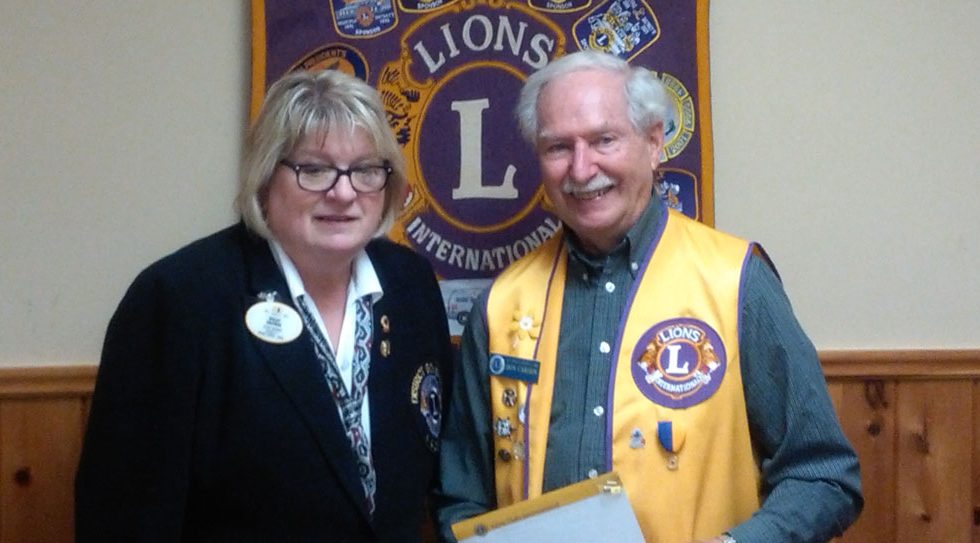 District Governor Shelley presenting Lion Don Carson with a 40 years of service pin