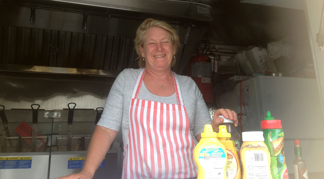 Owner Anne Wilby inside the Mellow Yellow food truck. Photo by Devyn Barrie.