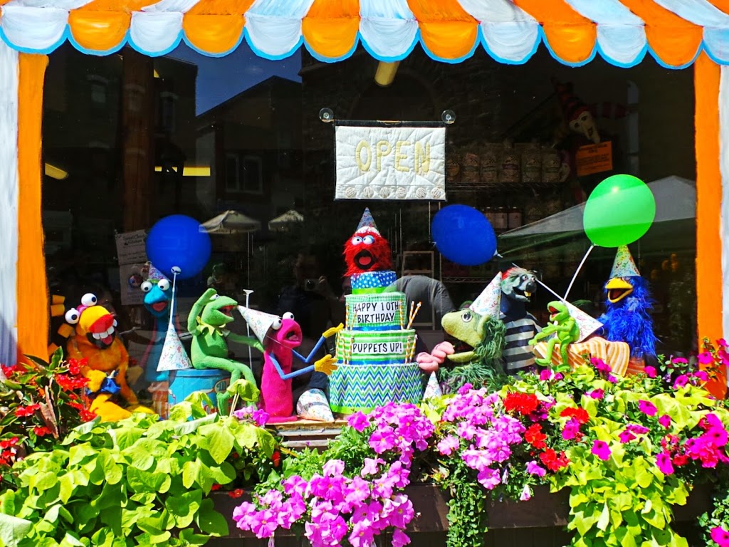 Puppets prepare to devour a birthday cake. Shop window at Bob’s Bakery in Almonte. Photo by Glen Gower.