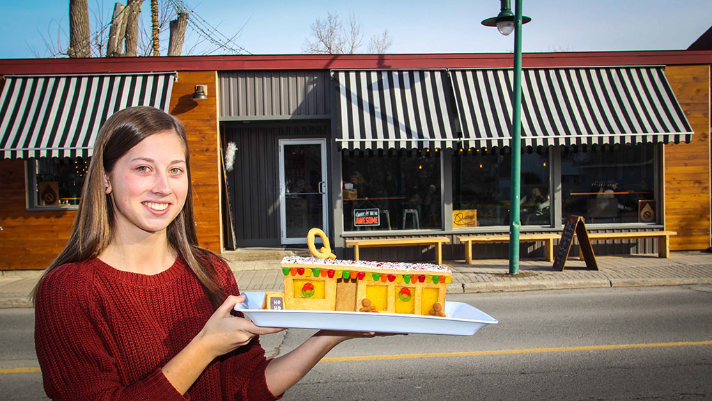 Amanda from Quitters shows off the replica gingerbread house that she made with a bit of help from her family.