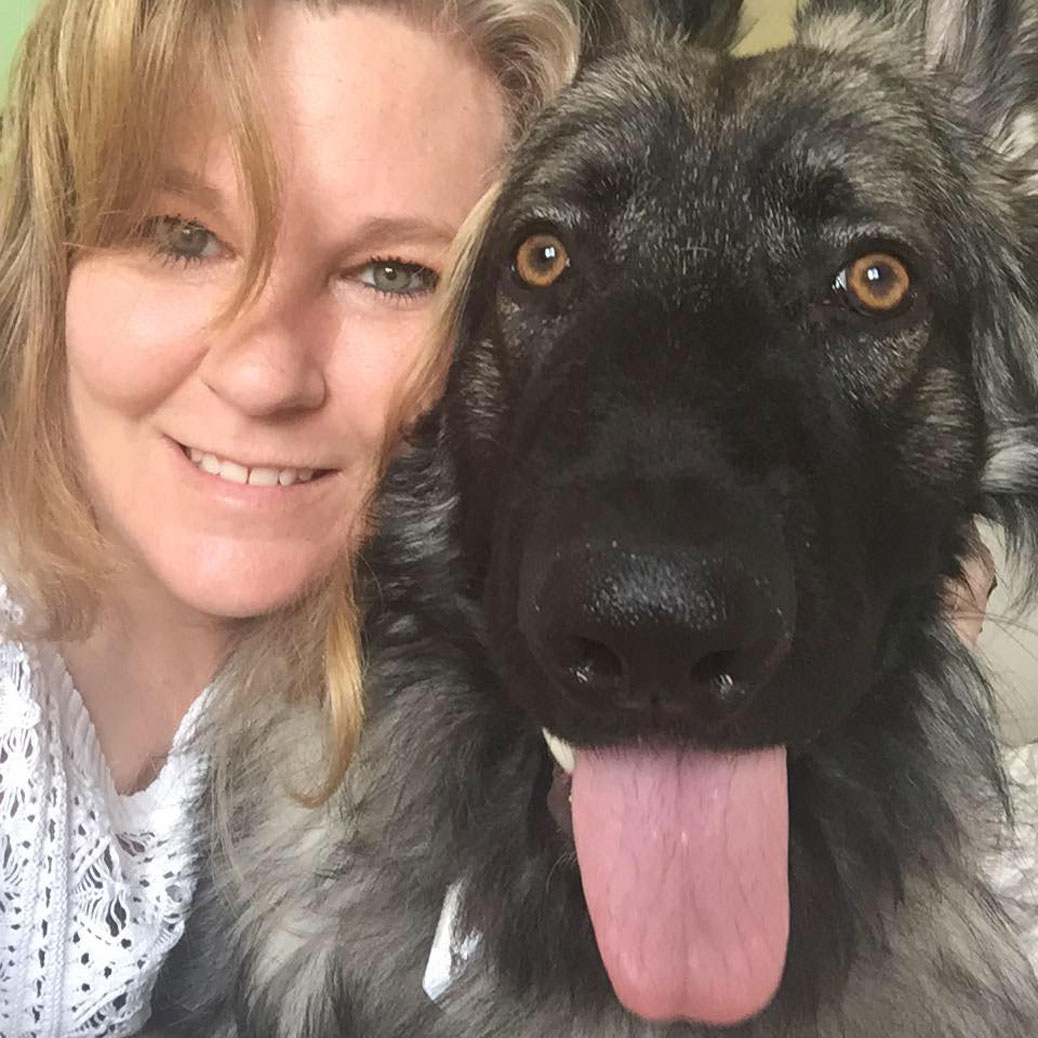 Shawna Church Roy with her first service dog, Bauer.