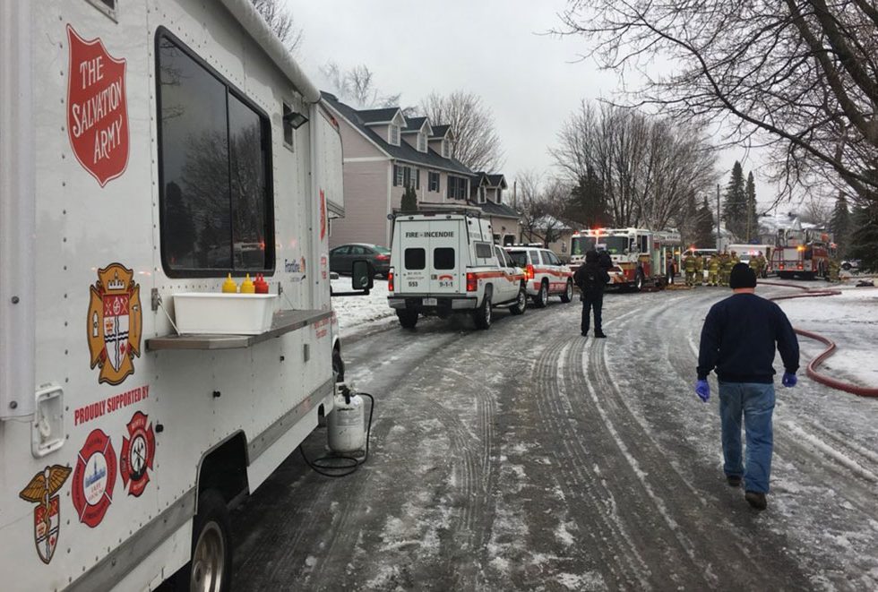 Emergency crews respond to the fire on Snowberry Way. Photo via the Salvation Army.