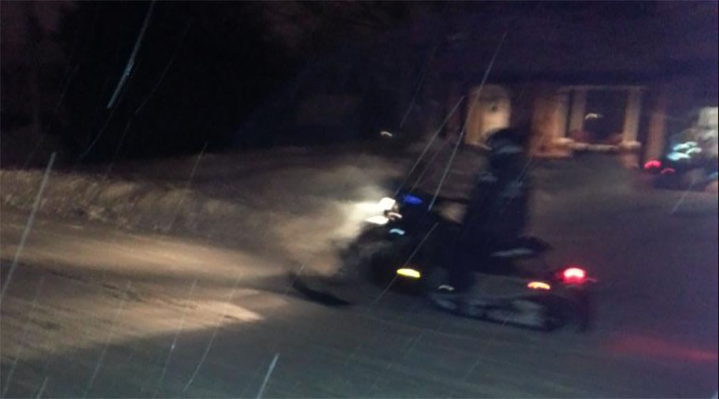 Snowmobile on Jonathan Pack Street in Stittsville.