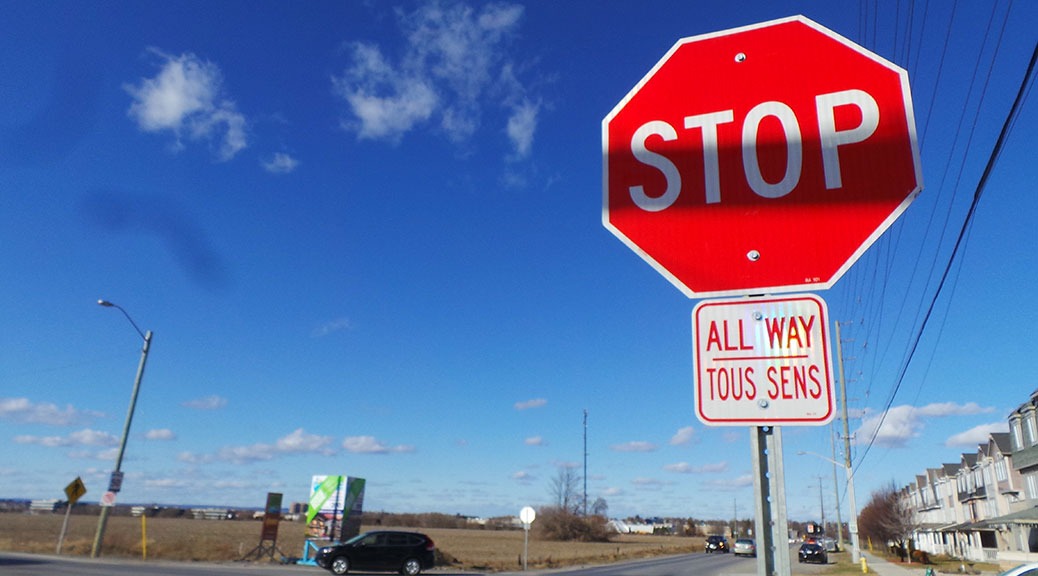 Stop sign at Huntmar and Maple Grove / photo by Glen Gower