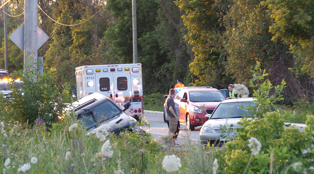 Car in the ditch on Huntmar, just south of Maple Grove. Photo by Glen Gower.