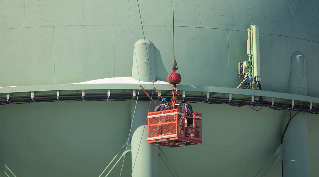 Contractors work on TELUS cell equipment on top of the Stittsville water tower. Photo by Barry Gray.